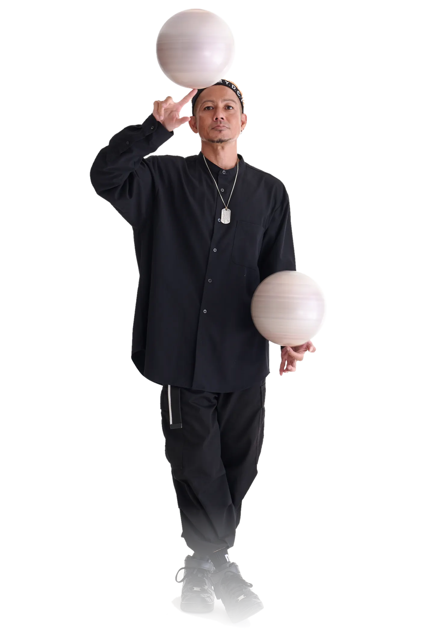 PERFORMER JJ handling two balls
